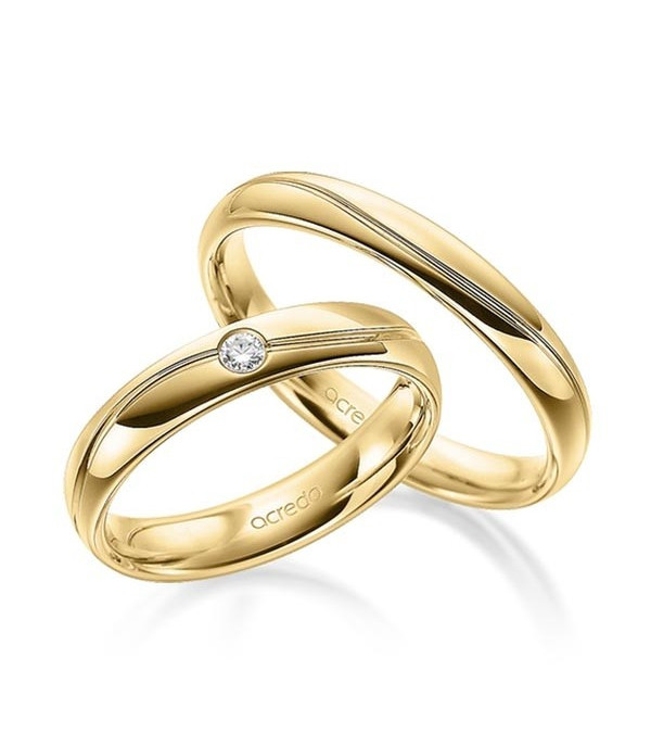 Anillos de boda en oro amarillo con una lénea redondeada y un diamante - Wedding bands - 




