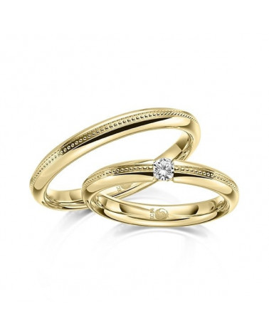 Pareja de alianzas de boda con diseño especial en oro con un diamante - Alianzas de boda - 


