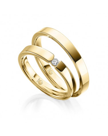 Alianzas de boda de oro con dos diamantes talla princesa