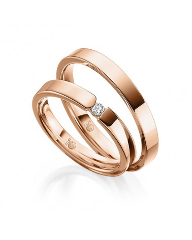 Alianzas de boda de oro con dos diamantes talla princesa